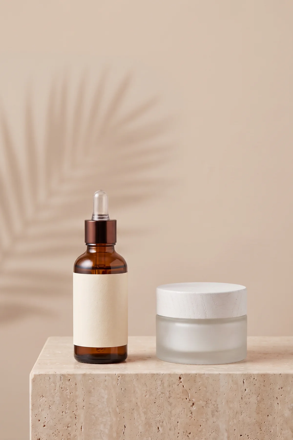 Amber serum bottle beside a frosted cosmetic jar after AI prop replacement