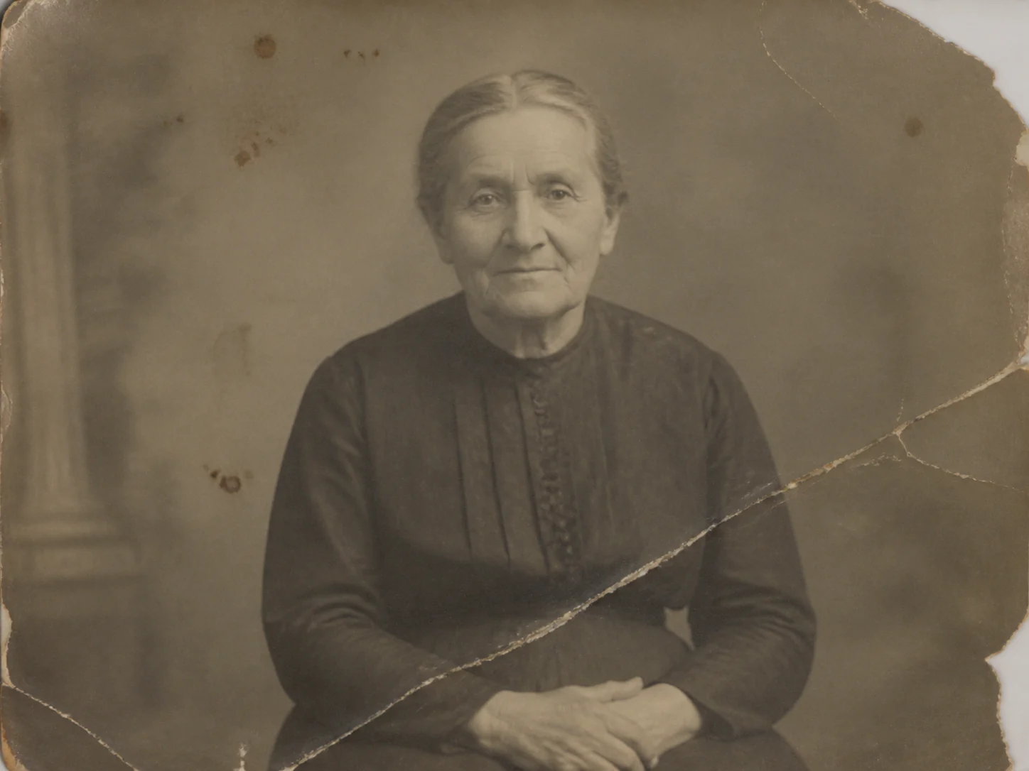 Damaged vintage portrait before AI restoration